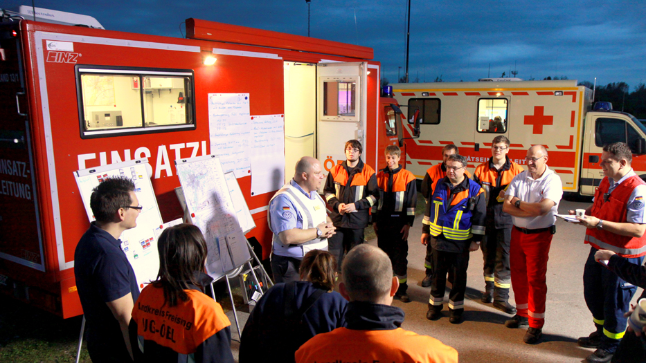 Rescue workers, firefighters and staff members of the Federal Technical Relief Agency coordinating an operation